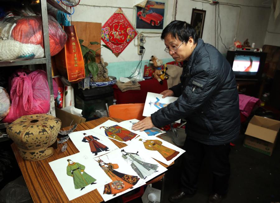 <?php echo strip_tags(addslashes(Han Xiaoli creates various headwear pieces for different stories and characters in qinqiang opera.  (Photo by Huo Yan/chinadaily.com.cn))) ?>