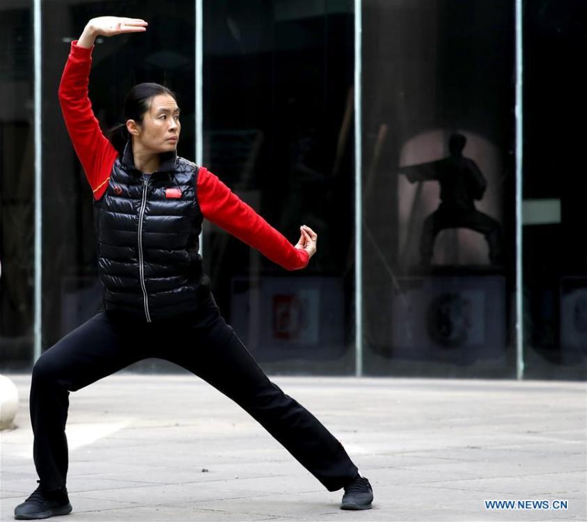 Huo Jinghong, the 5th generation descendant of Huo Yuanjia, a Chinese martial arts master, practices Huo-style boxing at Huo Yuanjia Memorial in Xiaonanhe Village of Jingwu Township in Tianjin, north China\'s Municipality, Nov. 28, 2018. As the descendant of Huo Yuanjia, one of China\'s most revered martial arts masters, Huo Jinghong, 41, started practicing martial arts at the age of 5. After her graduation from the Wushu School of Beijing Sport University in major of Wushu Routine, Huo started her career as a gym teacher of Tianjin University of Commerce in the year of 2000. As a gym teacher, Huo teaches martial arts for the university team and offers classes on health Qigong, a new form selected from different versions of traditional Qigong for modern fitness, in the university. Later in 2015, Huo became the inheritor of Huo-style boxing, which was listed as an intangible cultural heritage in Tianjin, and since then, she has devoted herself to the inheritance and development of the martial arts handed down from the older generation of Huo\'s family. She hoped that the Huo-style boxing would help people understand more about the Chinese martial arts. Huo Yuanjia was born in Tianjin in 1868. He founded the Chin Woo Athletic Association in 1910 in Shanghai and advocated the spirit of \