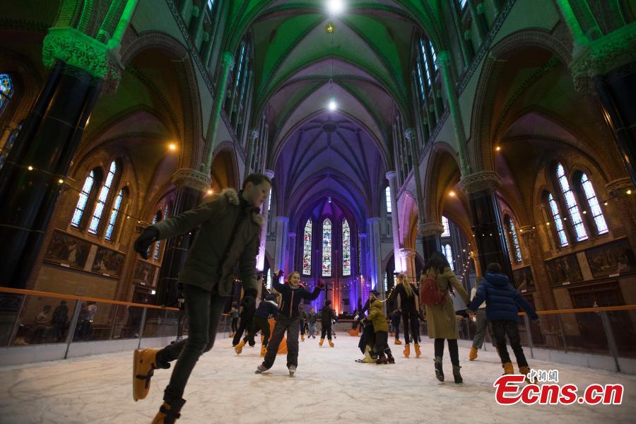 People skate on a temporary ice rink in the Gouwe Kerk church, a Gothic Revival church built between 1902 and 1904, in the center of Gouda, central Netherlands, Wednesday, Dec. 5, 2018. The ice rink will remain in the church till Dec. 16, and from Dec. 19, people can enjoy skating on the rink in front of the historic town hall of Gouda. (Photo/Agencies)