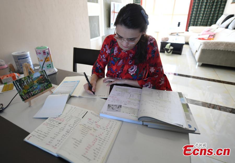 <?php echo strip_tags(addslashes(Valentina studies at her home in Changchun, Northeast China’s Jilin province. (Photo: China News Service/ Zhang Yao))) ?>