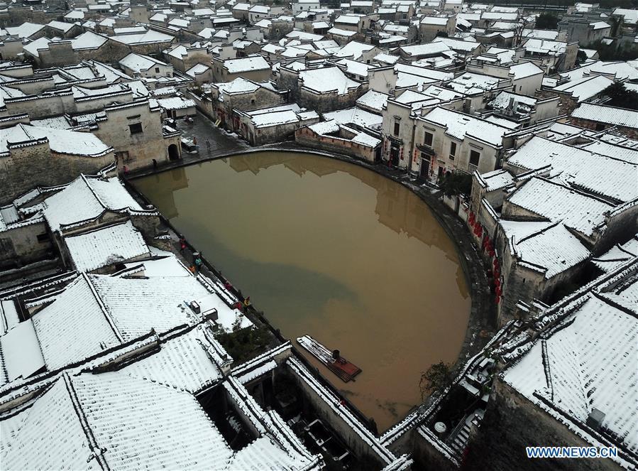 Aerial photo taken on Dec. 9, 2018 shows the snow scenery of Hongcun Village in Yixian County, east China\'s Anhui Province. The cold wave brought snowfall to the village in recent days. (Xinhua/Shi Yalei)