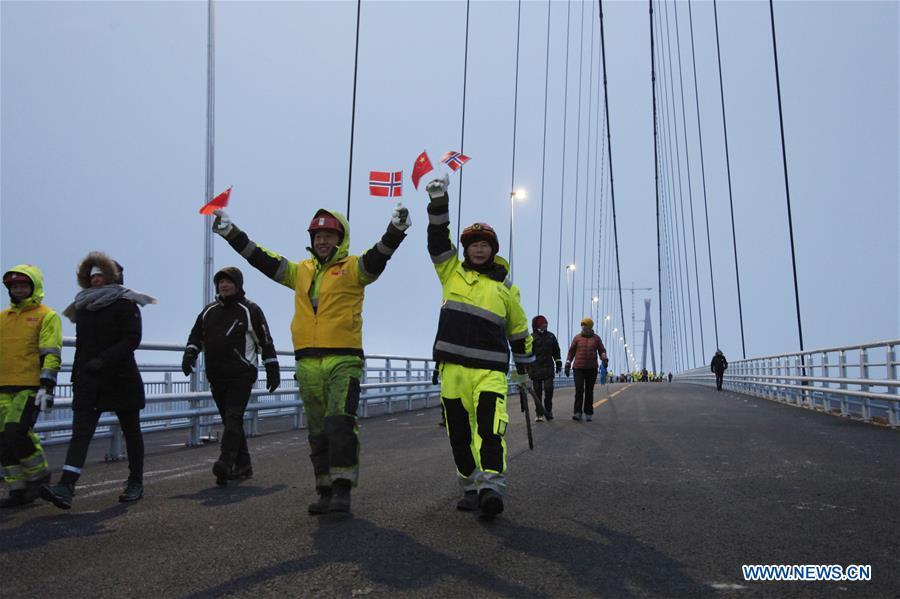 <?php echo strip_tags(addslashes(Chinese workers and Norwegian citizens walk on the Halogaland Bridge near Norway's northern port city of Narvik, Dec. 9, 2018. A ceremony was held Sunday to officially open Norway's second largest bridge that has been built by a Chinese company and its partners some 220 km inside the Arctic Circle. With a total length of 1,533 meters and a free span of 1,145 meters, the Halogaland Bridge near Norway's northern port city of Narvik is the longest suspension bridge within the Arctic Circle. (Xinhua/Liang Youchang))) ?>