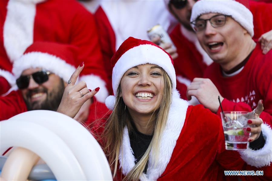 <?php echo strip_tags(addslashes(Revelers dressed as Santa Claus take part in the 2018 SantaCon in New York, the United States, Dec. 8, 2018. Dressed as Santa Claus or in festive costumes, hundreds of People participated in the 2018 SantaCon on Saturday, enjoying the Christmas atmosphere and raising money for charity. (Xinhua/Wang Ying))) ?>