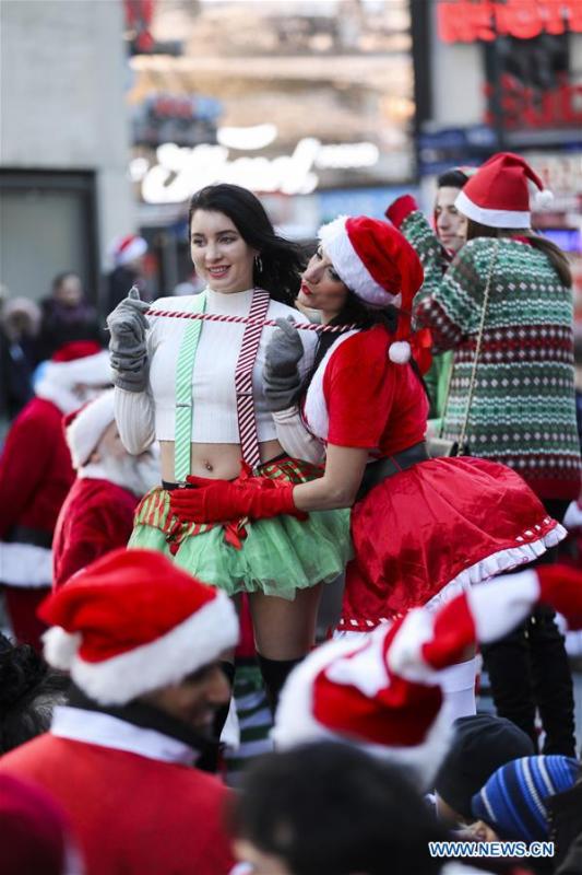 <?php echo strip_tags(addslashes(Revelers take part in the 2018 SantaCon in New York, the United States, Dec. 8, 2018. Dressed as Santa Claus or in festive costumes, hundreds of People participated in the 2018 SantaCon on Saturday, enjoying the Christmas atmosphere and raising money for charity. (Xinhua/Wang Ying))) ?>