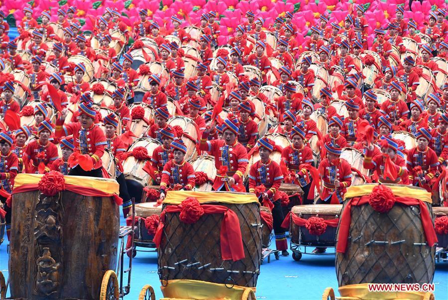 Dancers perform in a grand gathering held to celebrate the 60th anniversary of the founding of south China\'s Guangxi Zhuang Autonomous Region in Nanning, capital of Guangxi, Dec. 10, 2018. (Xinhua/Zhou Hua)