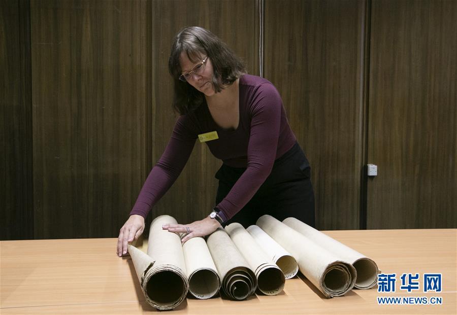 Archivist Rachel Gill shows the original designs for Chinese cruiser Zhiyuan at Tyne & Wear Archives in the city of Newcastle upon Tyne, England, Nov. 2, 2018. Zhiyuan, built and completed in England in 1887, was one of the most advanced warships in the Beiyang Fleet. It sank after the imperial Chinese navy was defeated in 1894 by the Japanese navy in the Battle of the Yellow Sea. The museum has a set of seven design drawings related to the Chinese cruiser. (Photo/Xinhua)