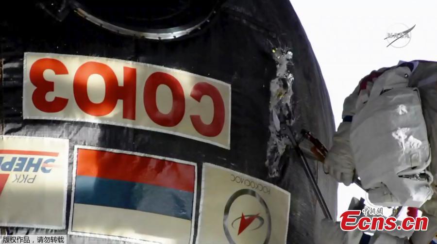 Two Russian cosmonauts have ventured outside the International Space Station today to inspect a section of a Russian spacecraft where a small hole was spotted. The mysterious leak was discovered on  August 30 in the Russian Soyuz craft which is attached to the ISS. It was initially believed to have been caused by a small meteorite and astronauts used tape to seal the leak after it caused a minor loss of pressure. Now, the two astronauts have confirmed the hole is safe - and the craft will be used again. (Photo/Agencies)