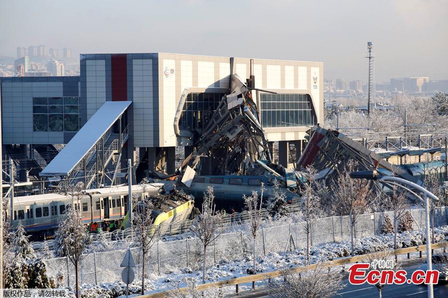 Rescue workers search at the accident site after a high speed train collides with a locomotive and crashes into an overpass at a train station in Ankara, Turkey, December 13, 2018. Four people were killed and more than 40 injured in the deadly crash, the governor\'s office reported.(Photo/Agencies)