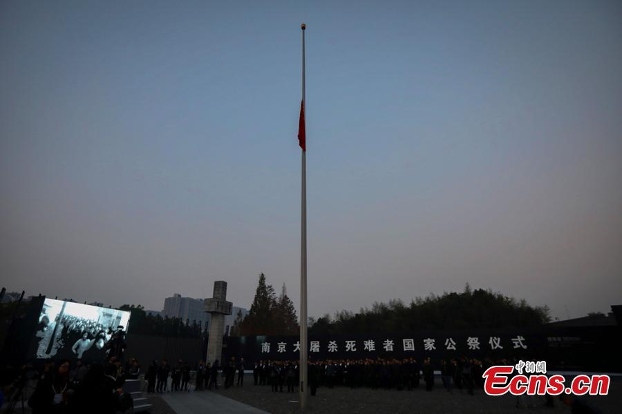 <?php echo strip_tags(addslashes(A national flag is flown at half-mast Thursday morning at the Memorial Hall for the Victims of the Nanjing Massacre, Dec. 13, 2018. On Thursday, China marked the fifth national memorial day to commemorate the victims of the Nanjing Massacre, in which Japanese invaders slaughtered about 300,000 Chinese during a six-week rampage after they captured the city, then China's capital, in 1937. In front of the darkly-dressed crowd at the ceremony, China's national flag is flown at half-mast. In February 2014, China's top legislature designated December 13 as the National Memorial Day for Nanjing Massacre Victims. (Photo: China News Service/Yang Bo))) ?>