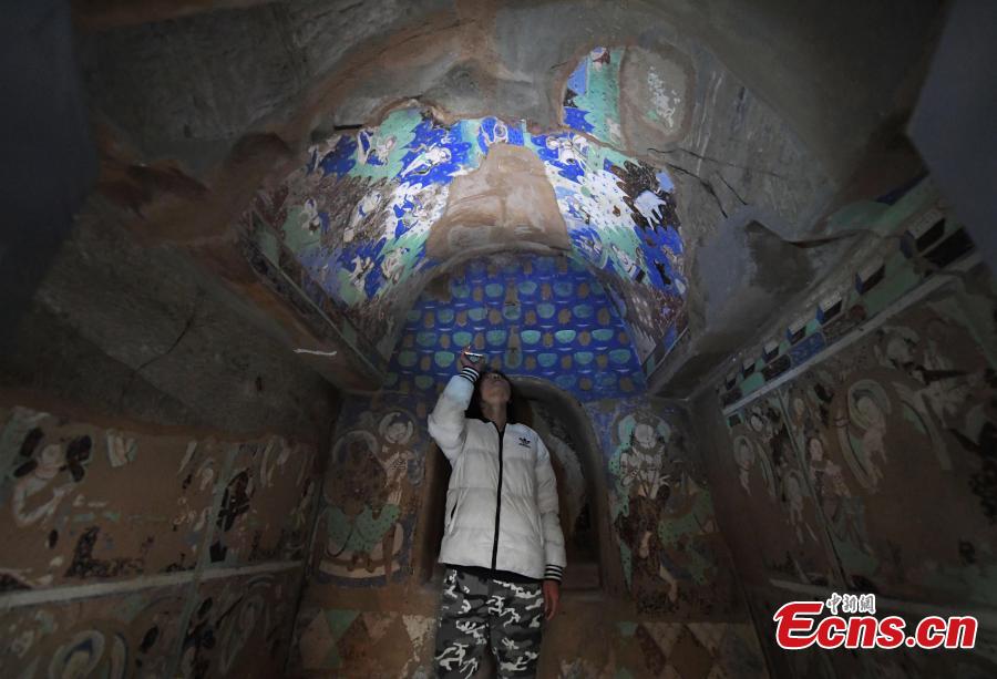 <?php echo strip_tags(addslashes(A visitor inside a life-size replica of a cave from the Kizil Caves in Northwest China’s Xinjiang Uygur Autonomous Region during an exhibition at Lanzhou University’s Yuzhong campus in Yuzhong County, Northwest China’s Gansu Province, December 13, 2018. Included in the exhibition were images of 137 murals, which were originally from the Kizil Caves but are now kept overseas, two replicas of original caves, and four digital caves. (Photo: China News Service/Yang Yanmin))) ?>
