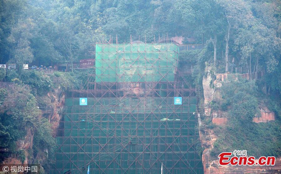 <?php echo strip_tags(addslashes(A 71-meter-tall Buddha statue-enclosed by scaffolding in the Leshan Giant Buddha Scenic Zone in Leshan, Sichuan province-has been undergoing repairs and maintenance since Oct 8. The price of entrance tickets to the scenic zone were cut by half on Monday because of the work, according to its administrative committee.(Photo/VCG))) ?>