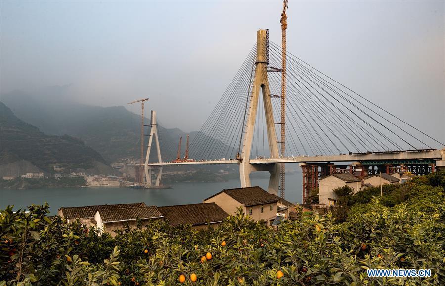 <?php echo strip_tags(addslashes(Photo taken on Dec. 16, 2018 shows the Xiangxi River Bridge in Zigui County of Yichang City, central China's Hubei Province. The closure of the bridge with a 470-meter main span was finished on Sunday. (Xinhua/Zheng Jiayu))) ?>