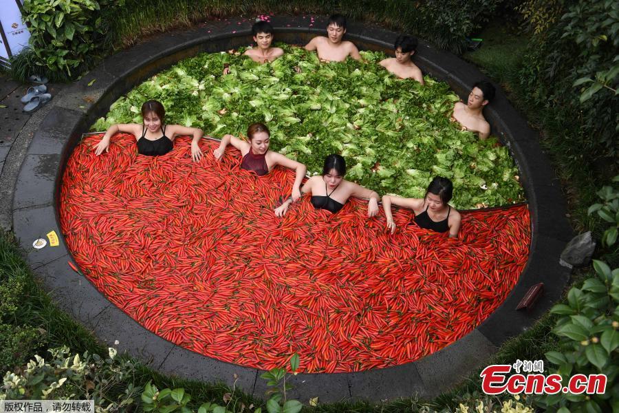 <?php echo strip_tags(addslashes(A group of people enjoy hotpots while soaking in a hotpot-style hot spring in the city of Hangzhou in Zhejiang Province, December 16, 2018. The hot spring designed as 