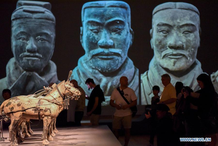 Visitors wait for entering the exhibition Terracotta Warriors: Guardians of Immortality at the National Museum of New Zealand in Wellington, New Zealand, on Dec. 15, 2018. The landmark exhibition of Terracotta Warriors: Guardians of Immortality opened to public on Saturday at the National Museum of New Zealand. The exhibition features eight warriors standing 180 cm tall, and two full-size horses from the famous terracotta army, as well as two half-size replica bronze horse-drawn chariots. Also on display are more than 160 exquisite works of ancient Chinese art made from gold, jade and bronze. \