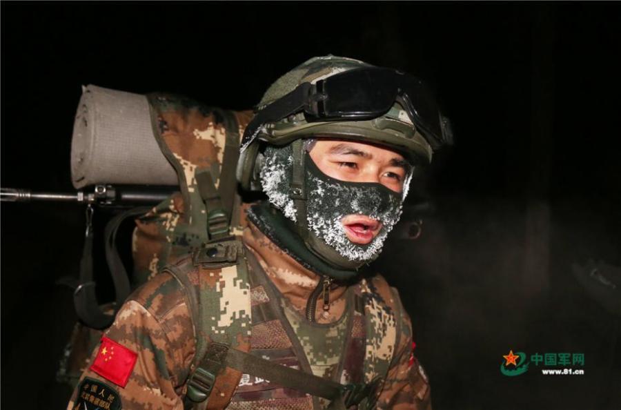 An armed police unit in northwestern China’s Ningxia Hui Autonomous Region recently conducted a 10-kilometer run while fully armed, in temperatures of minus 20 degrees Celsius. The soldiers\' hair, eyelashes, and masks were covered with a thin layer of ice after the long training session, showcasing their tenacity and spirit to challenge the limits. (Photo/www.81.cn)