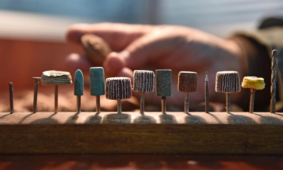 Han Zhiyao shows his works at his studio in Dalian, Liaoning Province, on Dec. 12.