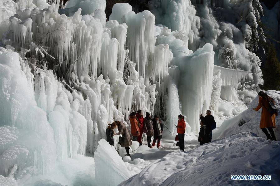 Tourists admire icicles at Dadunxia scenic spot in Linxia Hui Autonomous Prefecture, northwest China\'s Gansu Province, Dec. 16, 2018. (Xinhua/Shi Youdong)
