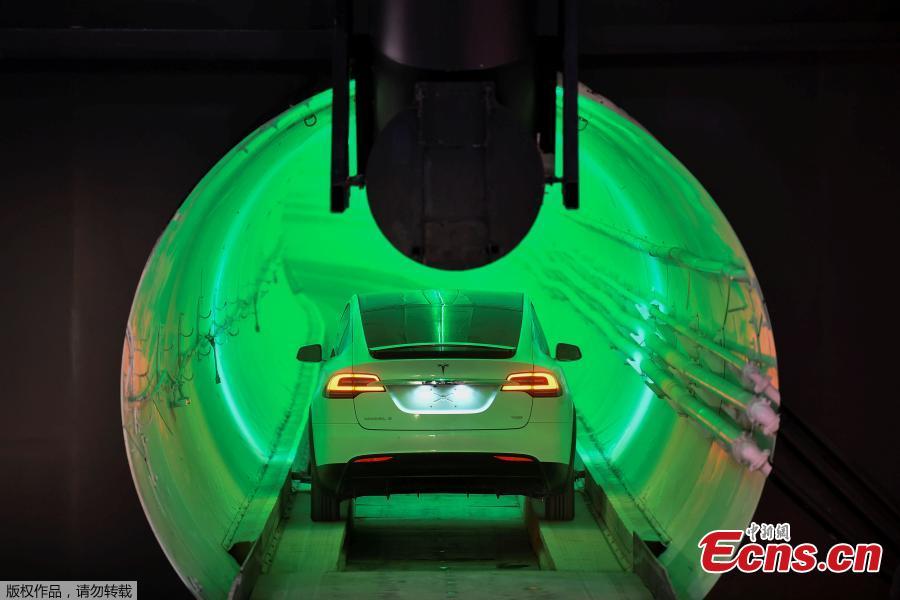 <?php echo strip_tags(addslashes(Elon Musk, co-founder and chief executive officer of Tesla Inc., arrives in a modified Tesla Model X electric vehicle during an unveiling event for the Boring Company Hawthorne test tunnel in Hawthorne, California, U.S., Dec. 18, 2018. Musk unveiled his underground transportation tunnel on Tuesday, allowing reporters and invited guests to take some of the first rides in the revolutionary albeit bumpy subterranean tube — the tech entrepreneur's answer to what he calls 