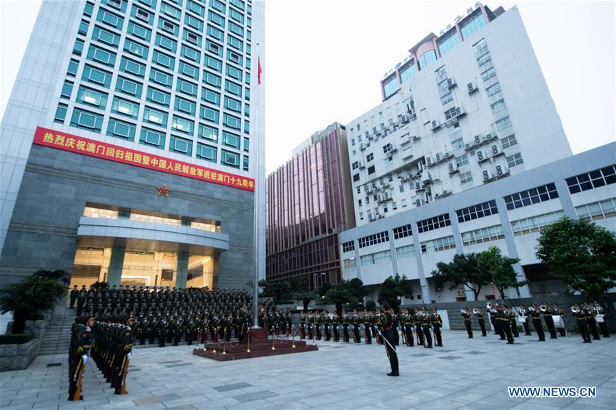 The Macao garrison of the Chinese People\'s Liberation Army (PLA) holds a flag-raising ceremony to celebrate the 19th anniversary of Macao\'s return to the motherland in Macao, south China, Dec. 20, 2018. (Xinhua/Cheong Kam Ka)