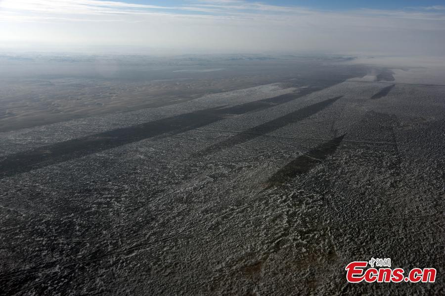 An aerial view of the Badain Jaran Desert in North China\'s Inner Mongolia Autonomous region, Dec. 20, 2018. As the third largest desert in China, it features over 140 lakes that lie between the dunes, although its annual precipitation is less than 40 millimeters. (Photo: China News Service/Sun Zifa)