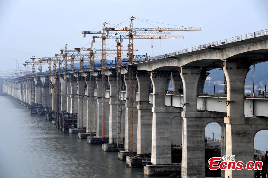 <?php echo strip_tags(addslashes(Photo taken on Dec. 20, 2018 shows the cross-Straits highway-rail bridge under construction in Pingtan, East China's Fujian Province. The first of its kind in China, the combined cross-sea rail and highway bridge across the Pingtan Straits has two layers, one for railways from Fuzhou to Pingtan, the other for a highway from Changle to Pingtan. The bridge spanning 16.45 km will open to traffic in 2019. (Photo: China News Service/Zhang Bin))) ?>
