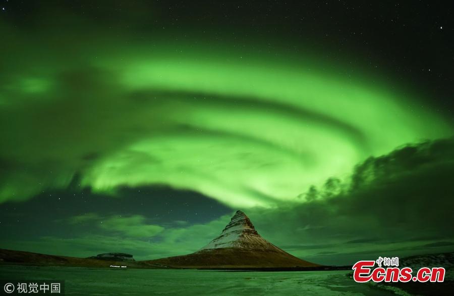 <?php echo strip_tags(addslashes(Aurora Borealis, the Northern Lights, over Kirkjufell, a 463 meter mountain on the west coast of Iceland. (Photo by Owen Humphreys/PA Images via Getty Images))) ?>