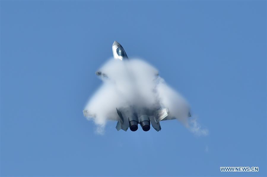 <?php echo strip_tags(addslashes(A J-20 fighter jet performs an aerobatics display during the 12th China International Aviation and Aerospace Exhibition (Airshow China) in Zhuhai, south China's Guangdong Province, on Nov. 6, 2018. The living and working scenes of Chinese people in the past year have created a series of amazing views, some of which formed geometric figures. Those photos tell the development and progress of the country in 2018. (Xinhua/Liang Xu))) ?>