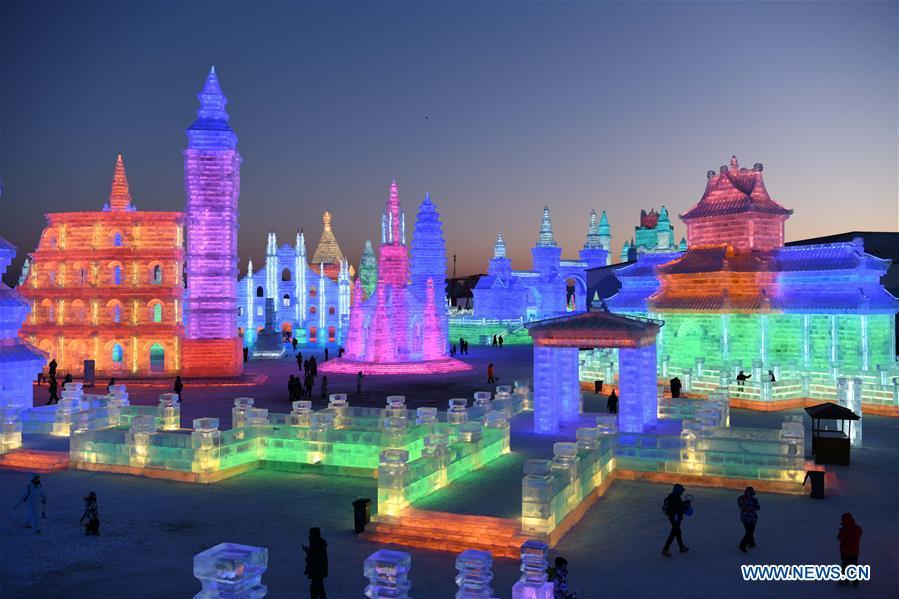 Tourists visit the Ice-Snow World in Harbin, capital of northeast China\'s Heilongjiang Province, Dec. 23, 2018. The Ice-Snow World opened on Sunday in Harbin. Covering an area of 600,000 square meters, the park used 110,000 cubic meters of ice and 120,000 cubic meters of snow this year. (Xinhua/Wang Jianwei)