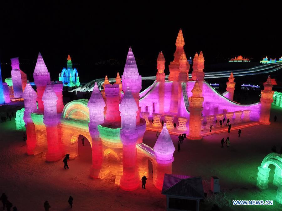 <?php echo strip_tags(addslashes(Tourists visit the Ice-Snow World in Harbin, capital of northeast China's Heilongjiang Province, Dec. 23, 2018. The Ice-Snow World opened on Sunday in Harbin. Covering an area of 600,000 square meters, the park used 110,000 cubic meters of ice and 120,000 cubic meters of snow this year. (Xinhua/Wang Song))) ?>