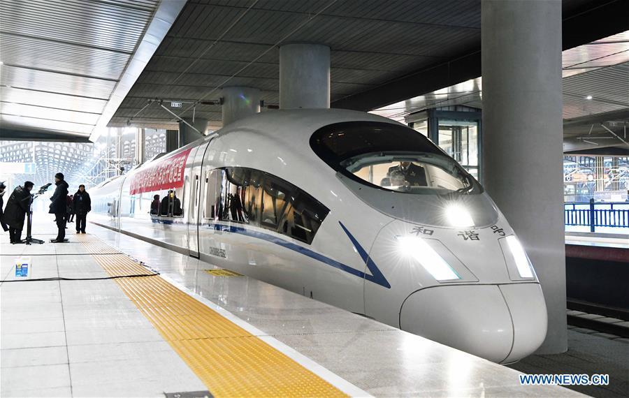 The first bullet train of the Harbin-Mudanjiang high-speed rail line waits to leave Harbin Railway Station in Harbin, northeast China\'s Heilongjiang Province, Dec. 25, 2018. A high-speed railway line officially went into operation on Tuesday, linking cities of Harbin and Mudanjiang in China\'s northernmost province of Heilongjiang, where the temperatures dip as low as minus 40 degrees Celsius. (Xinhua/Wang Jianwei)