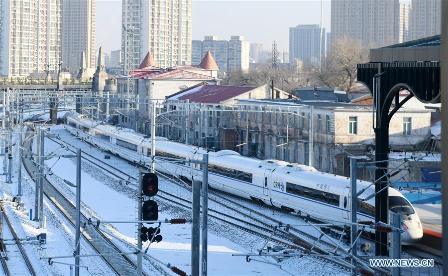 The first bullet train of the Harbin-Mudanjiang high-speed rail line leaves Harbin Railway Station in Harbin, northeast China\'s Heilongjiang Province, Dec. 25, 2018. A high-speed railway line officially went into operation on Tuesday, linking cities of Harbin and Mudanjiang in China\'s northernmost province of Heilongjiang, where the temperatures dip as low as minus 40 degrees Celsius. (Xinhua/Wang Jianwei)