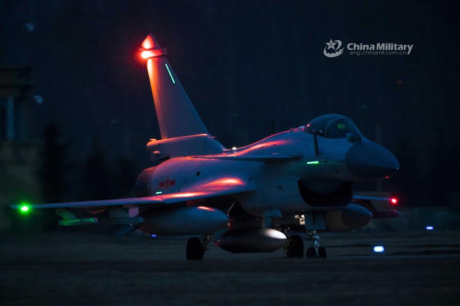 A J-10 fighter jet attached to an aviation brigade of the air force under the PLA Northern Theater Command taxis on the runway before takeoff during a recent night flight training exercise. (Photo/eng.chinamil.com.cn)