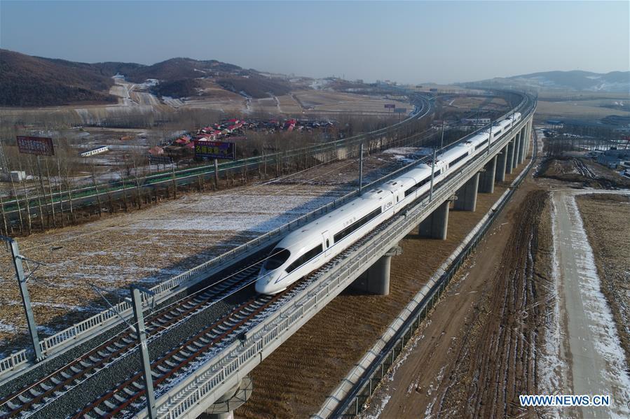 A bullet train runs in the suburbs of Mudanjiang, northeast China\'s Heilongjiang Province on Dec. 25, 2015. A high-speed railway line officially went into operation on Tuesday, linking cities of Harbin and Mudanjiang in China\'s northernmost province of Heilongjiang, where the temperatures dip as low as minus 40 degrees Celsius. (Xinhua/Zhang Chunxiang)