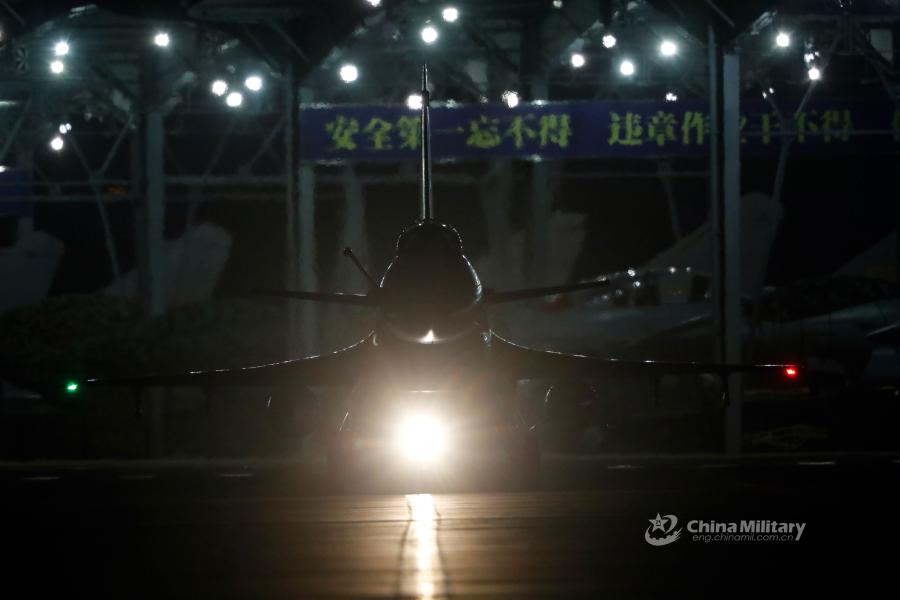 A J-10 fighter jet attached to an aviation brigade of the air force under the PLA Northern Theater Command taxis on the runway before takeoff during a recent night flight training exercise. (Photo/eng.chinamil.com.cn)