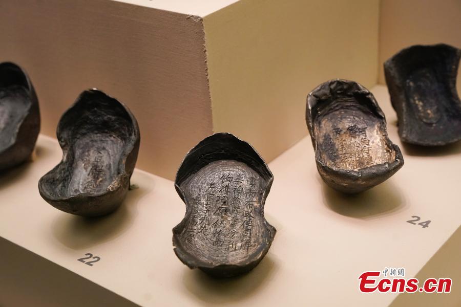 Cultural relics, including bronze wares and silver ingots, retrieved by police are on display at an exhibition at the National Museum of China in Beijing, Dec. 26, 2018. The exhibition displays 750 precious artifacts retrieved during police efforts in recent years fighting crime involving stolen cultural treasures, which hail from Neolithic times through to the Qing Dynasty. (Photo: China News Service/Du Yang)