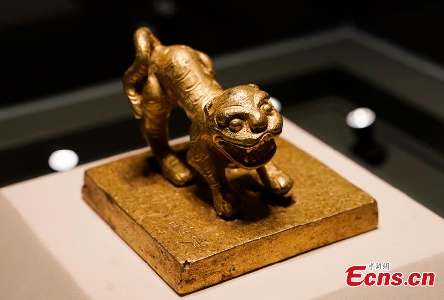 A gold seal from Meishan in Sichuan Province, used by rebels near the end of the Ming Dynasty (1368-1644), is on display at an exhibition at the National Museum of China in Beijing, Dec. 26, 2018. The exhibition displays 750 precious artifacts retrieved during police efforts in recent years fighting crime involving stolen cultural treasures, which hail from Neolithic times through to the Qing Dynasty. (Photo: China News Service/Du Yang)