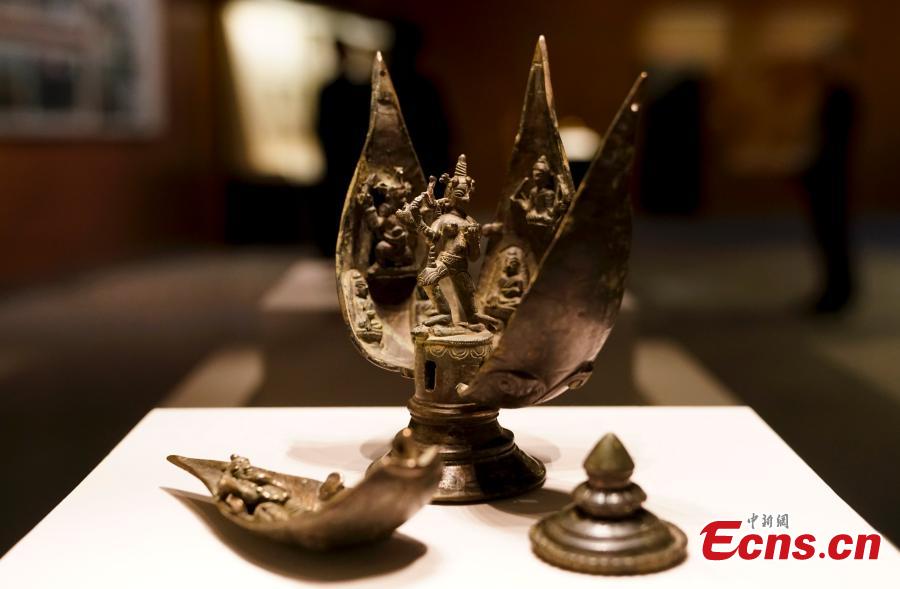 A cultural relic retrieved by police after it was stolen from the Tibet Autonomous Region is on display at an exhibition at the National Museum of China in Beijing, Dec. 26, 2018. The exhibition displays 750 precious artifacts retrieved during police efforts in recent years fighting crime involving stolen cultural treasures, which hail from Neolithic times through to the Qing Dynasty. (Photo: China News Service/Du Yang)