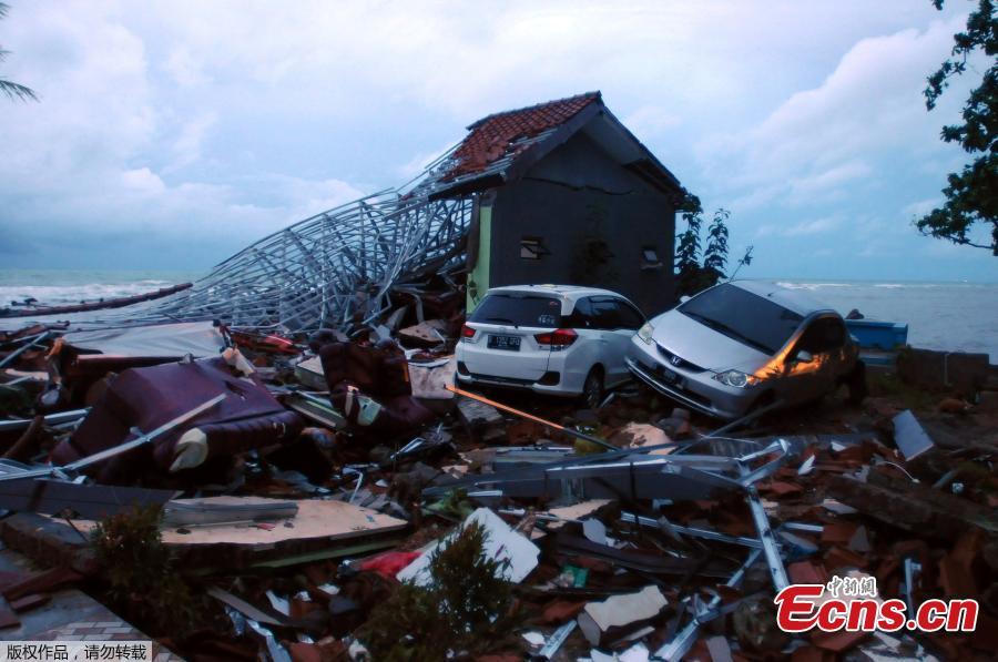 Damaged cars are seen after a tsunami in Banten province, Indonesia, Dec. 26, 2018. Indonesian rescue teams on Wednesday struggled to reach remote areas on the western coast of Java amid an \