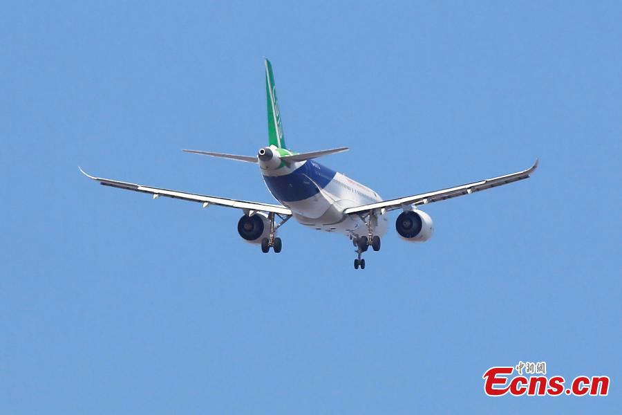 China\'s domestically developed C919 passenger jet is seen during a test flight at Pudong International Airport in Shanghai, Dec. 28, 2018. The third C919 plane, developed by the state-owned Commercial Aircraft Corp. of China (COMAC), took a test flight at the busy airport\'s 4th runway. (Photo: China News Service/Yin Liqin)