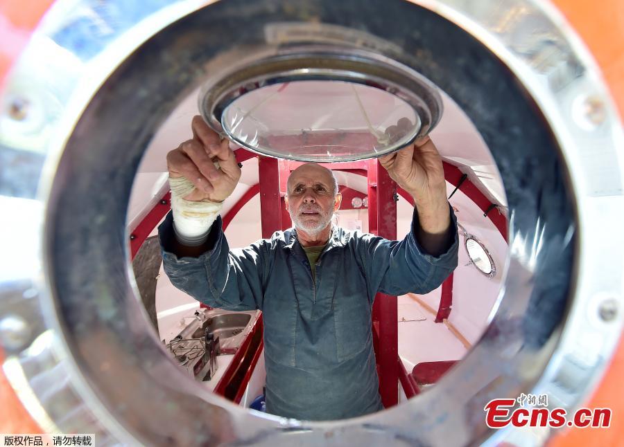 Jean-Jacques Savin, a former paratrooper, 71, works on the construction of a ship made from a barrel on Nov. 15, 2018 at the shipyard in Ares, southwestern France. The Frenchman has embarked on an epic journey across the Atlantic on a barrel-shaped capsule heading towards the Caribbean. (Photo/Agencies)