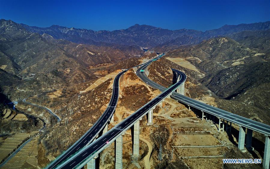 <?php echo strip_tags(addslashes(Photo taken on Dec. 25, 2018 shows the junction of Laiqu section of Taihang Mountain expressway and Rongcheng-Wuhai expressway in north China's Hebei Province. The Taihang Mountain expressway linking Hebei with Beijing started operation Friday. The expressway, with a total length of 650 km, connects Hebei's mountainous region with the capital and its neighboring provinces including Shanxi and Henan, benefiting a total of 7.4 million people living in the mountainous areas. (Xinhua/Yang Shiyao))) ?>