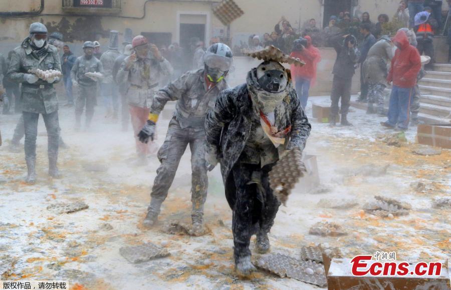<?php echo strip_tags(addslashes(Revelers battle with flour and eggs during the traditional 