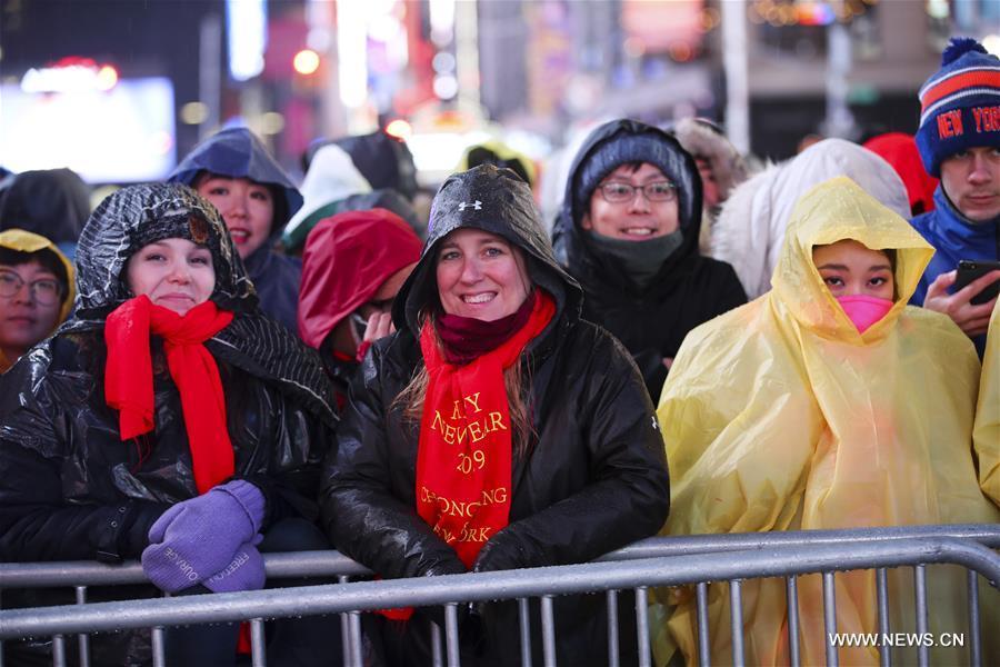People wait for the New Year celebration on Times Square in New York, the United States, on Dec. 31, 2018. (Xinhua/Wang Ying)