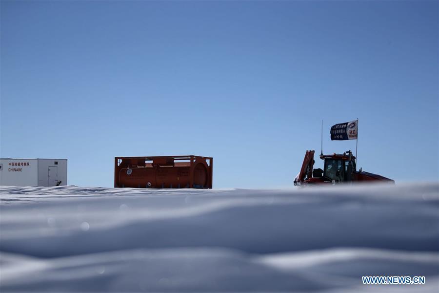 A tractor of China\'s 35th Antarctic expedition team runs through ice knolls in Antarctica Dec. 31, 2018. The expedition team, expected to arrive at Kunlun Station in five days at about 4,000 meters above the sea level near Dome A, entered into the Antarctic Plateau on Monday. (Xinhua/Liu Shiping)