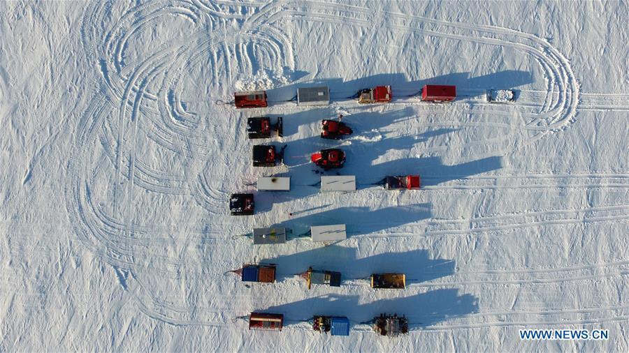 Aerial photo taken on Jan. 1, 2019 shows vehivles of China\'s 35th Antarctic expedition team at their camp in Antarctica. The expedition team, expected to arrive at Kunlun Station in five days at about 4,000 meters above the sea level near Dome A, entered into the Antarctic Plateau on Monday. (Xinhua/Liu Shiping)