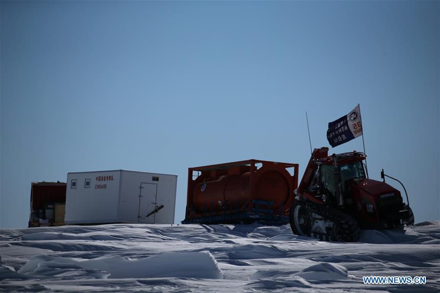 A tractor of China\'s 35th Antarctic expedition team runs through ice knolls in Antarctica Dec. 31, 2018. The expedition team, expected to arrive at Kunlun Station in five days at about 4,000 meters above the sea level near Dome A, entered into the Antarctic Plateau on Monday. (Xinhua/Liu Shiping)