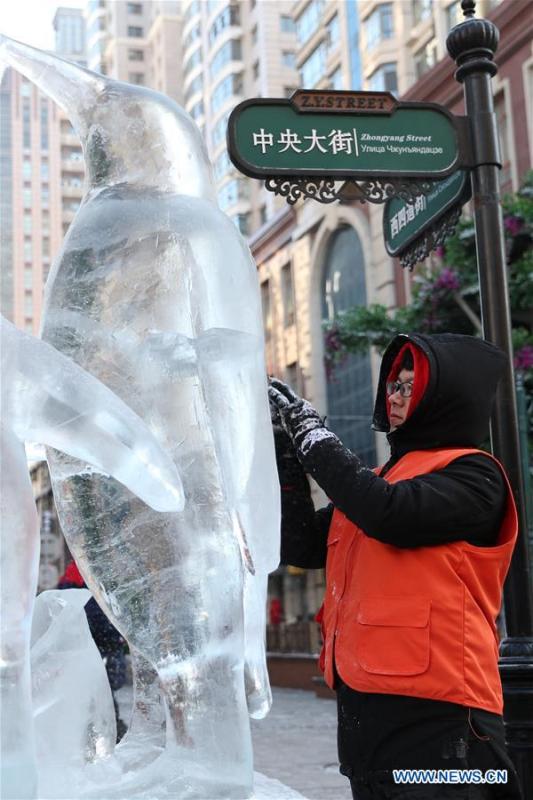 <?php echo strip_tags(addslashes(A contestant carves an ice sculpture on the Zhongyang Street during a national college ice sculpture competition in Harbin, capital of northeast China's Heilongjiang Province, Jan. 2, 2019. (Xinhua/Cao Jiyang))) ?>