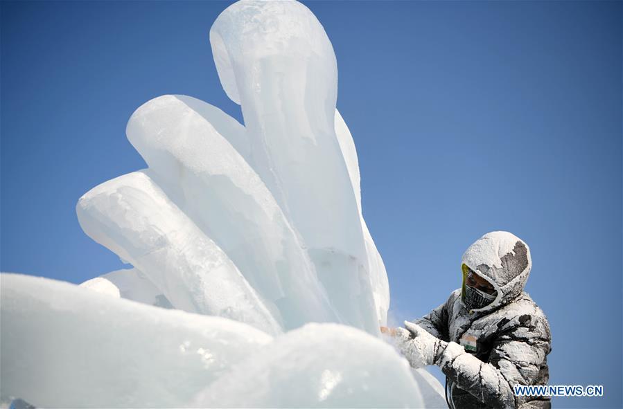 A contestant makes an ice sculpture during an international ice sculpture competition in Harbin, capital of northeast China\'s Heilongjiang Province, Jan. 3, 2019. (Xinhua/Wang Jianwei)