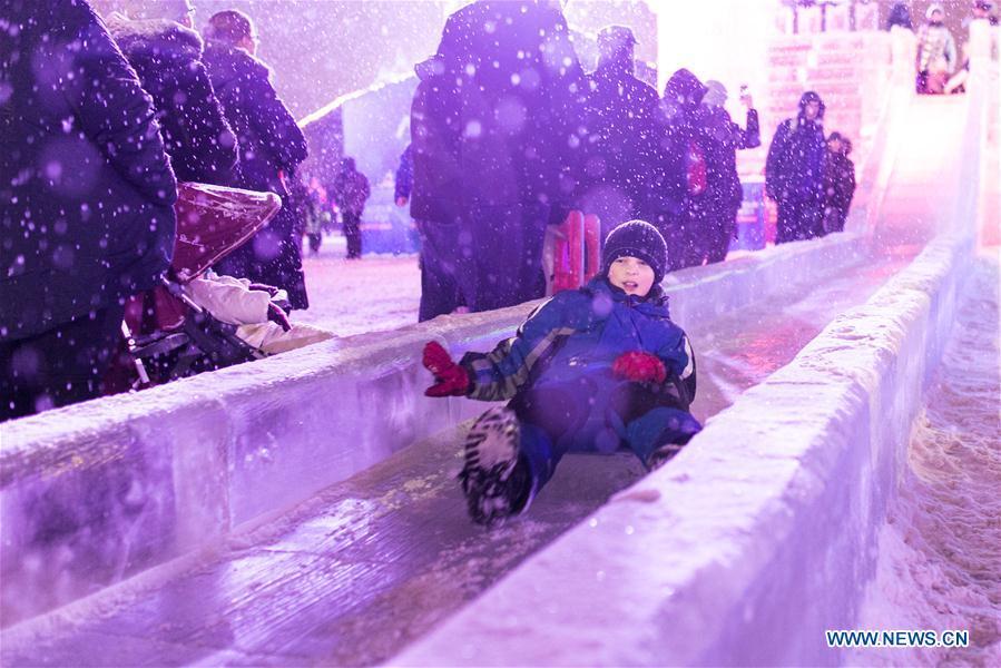 A child slides during Moscow ice festival in Moscow, Russia, on Jan. 3, 2019. Moscow ice festival opened in Victory Park from Dec. 29, 2018 to Jan. 13, 2019. (Xinhua/Bai Xueqi)