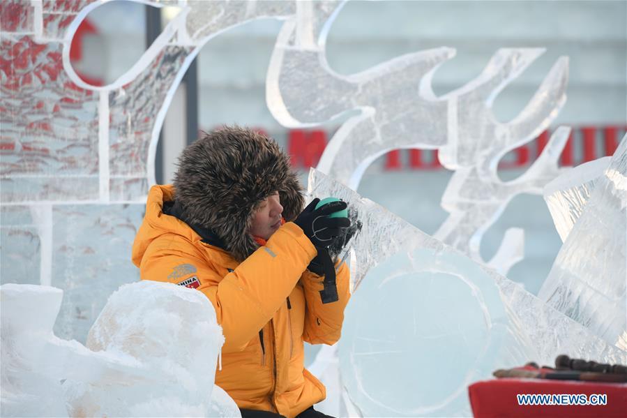 A contestant carves an ice sculpture during an international ice sculpture competition in Harbin, capital of northeast China\'s Heilongjiang Province, Jan. 3, 2019. (Xinhua/Wang Song)